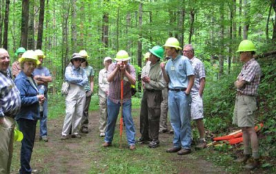 Workshop participants learn how to measure road grade with an Abney level. Photo by Randy Fowler, U.S. Forest Service.